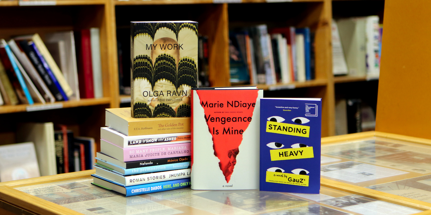 A photo of a stack of books, all new literature in translation published in October 2023