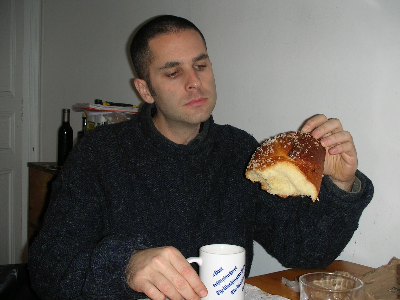 The author in Paris in 2008, thinking small thoughts with a big brioche