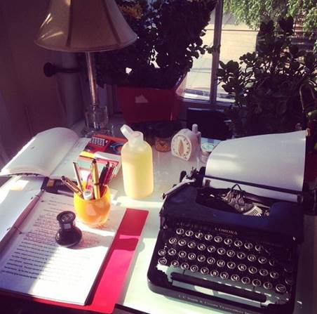 IMG: A desk with a typewriter.