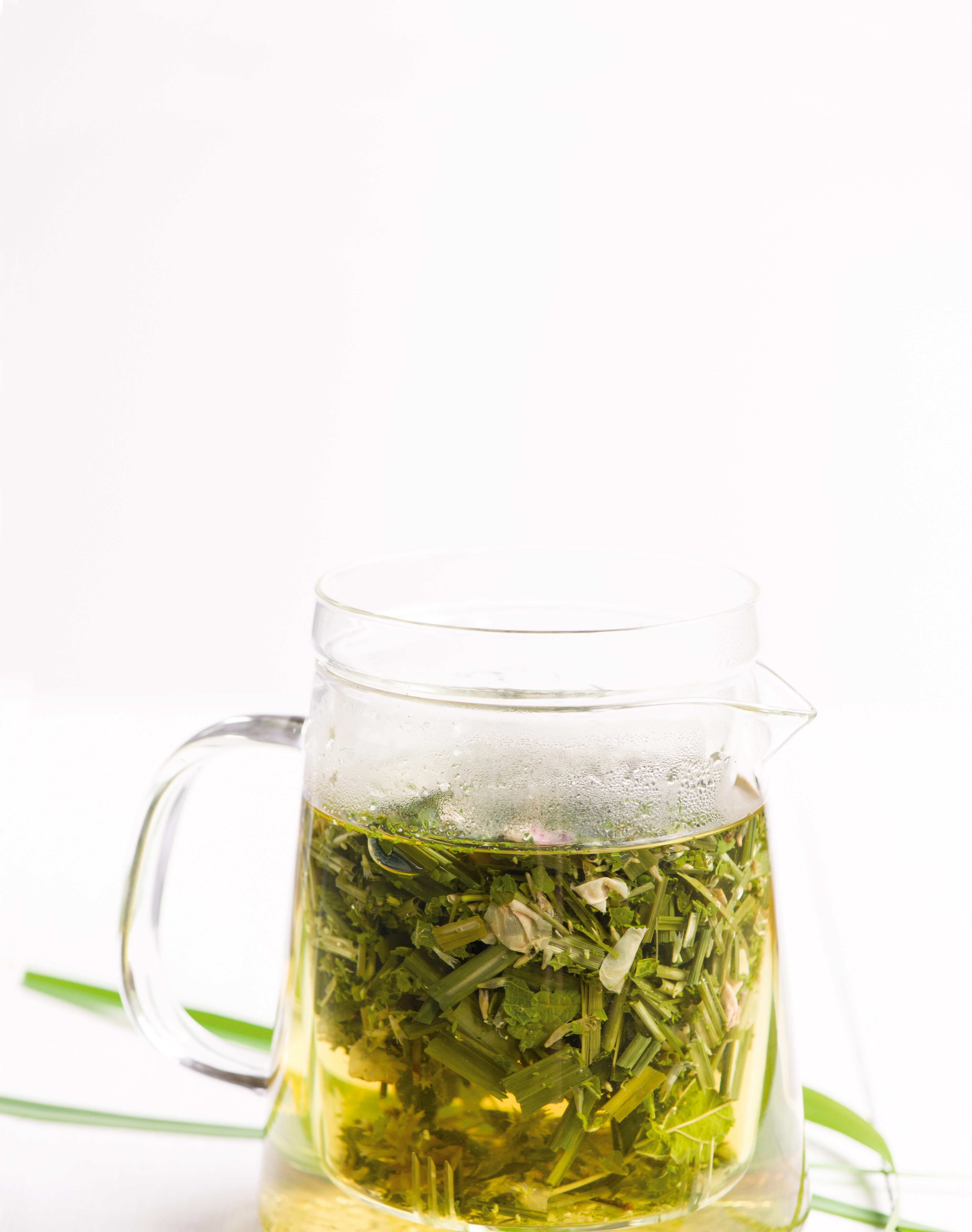 A clear mug filled with brewing tea.
